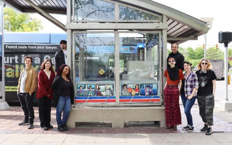 From left are CIA students Alex Drusky, Annelise Abruzzi, Nathan Jaros, Nichole Otey, Teddy Church, Steven Gutierrez (CIA associate professor), Hope Mocadlo and Kiera Daugherty at the westbound RTA bus shelter at Euclid Ave. and Stokes Blvd.